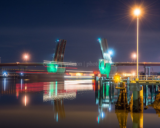 Barge Passing Under the Casco Bay Bridge at Night