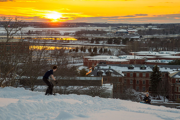 Snowboarding on the Western Promenade at Sunset