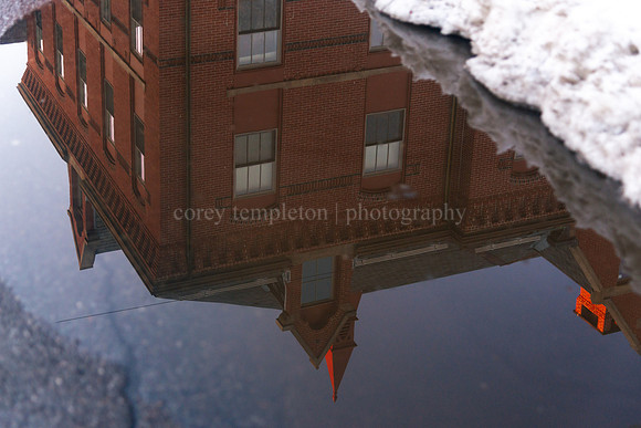 Reflection in Puddle of the former Butler School in the West End