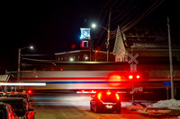 Amrak Downeaster Passing through Woodfords Corner at Night