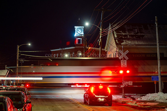 Amrak Downeaster Passing through Woodfords Corner at Night
