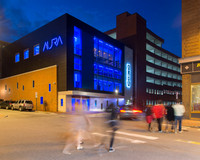 Aura 121 Center Street Exterior along Free Street at Night