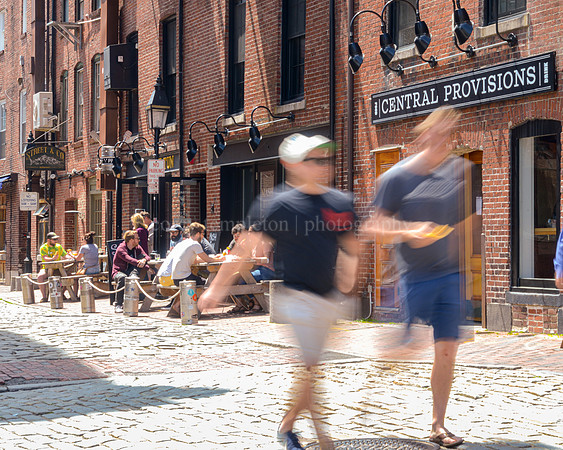 People on Wharf Street on a Sunny Afternoon