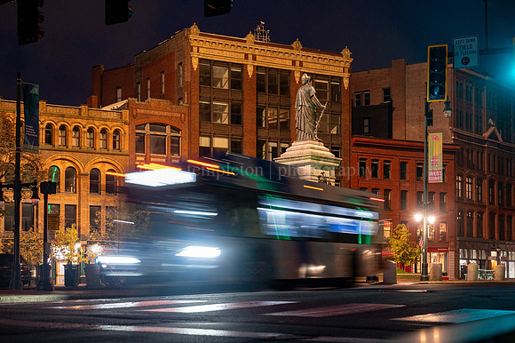 Metro Bus Going by Monument Square Night